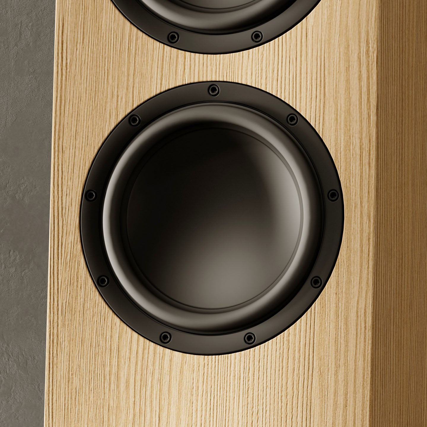 Close-up of a Marten speaker with a wooden finish and black driver unit.