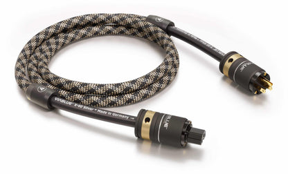 Coiled audio cable with gold connectors on a white background